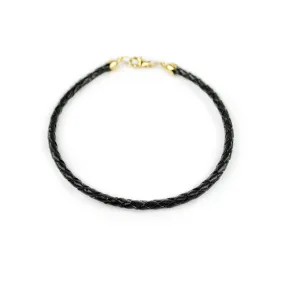 Bracciale uomo pelle intrecciata nera e chiusura in oro giallo